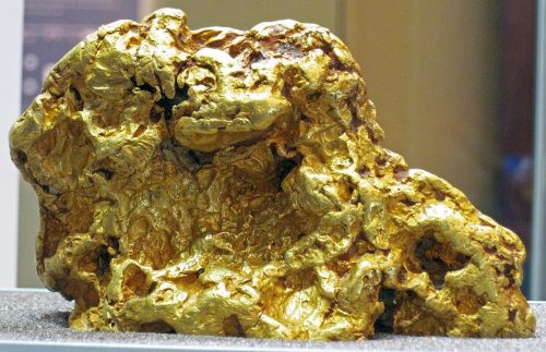 Gold nugget from Australia. (public display, Field Museum of Natural History, Chicago, Illinois, USA). The Australian rock shown above is a large, nearly four pound mass of gold. The irregularly-distributed, smoothly sculpted surfaces had indicated that this is likely a fluvial gold cobble - in other words, it appears to be from a placer deposit. Gold is a metal. 